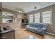 Inviting living room with large windows, ceiling fan, and an open layout, ideal for modern living at 3795 W Mercury Way, Chandler, AZ 85226