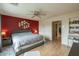 Bright primary bedroom with a large bed, accent wall, and ample natural light, offering a comfortable space at 3795 W Mercury Way, Chandler, AZ 85226