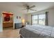Bright primary bedroom with a large window and a glimpse into the bathroom, offering a cozy retreat at 3795 W Mercury Way, Chandler, AZ 85226