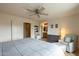 Serene primary bedroom featuring a spacious layout, soft lighting, and a comfortable chair for a relaxing atmosphere at 3795 W Mercury Way, Chandler, AZ 85226