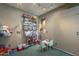 Cozy play room features vibrant colors, storage shelves, and table at 3795 W Mercury Way, Chandler, AZ 85226