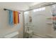 Clean shower with glass door, built-in shelves, and accessible seating, providing a comfortable bathing experience at 3795 W Mercury Way, Chandler, AZ 85226