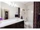 Bathroom with vanity, shelves, and a shower-tub combination at 40707 W Pryor Ln, Maricopa, AZ 85138