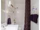 Bathroom with vanity, shelves, and a shower-tub combination at 40707 W Pryor Ln, Maricopa, AZ 85138
