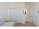 Bright bedroom featuring a closet and access to another room at 40707 W Pryor Ln, Maricopa, AZ 85138