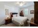 Cozy bedroom featuring a comfortable bed, ceiling fan, and light neutral walls at 40707 W Pryor Ln, Maricopa, AZ 85138