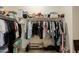 Walk-in closet with clothing racks, overhead shelves, and shoe storage space; offers plenty of organization at 40707 W Pryor Ln, Maricopa, AZ 85138
