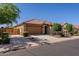 Beautiful single-story home with a tile roof, well-kept landscaping, and a side gate to the backyard at 40707 W Pryor Ln, Maricopa, AZ 85138