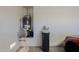 Garage featuring water heater, water softener system and a view of a parked car at 40707 W Pryor Ln, Maricopa, AZ 85138