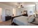 Large main bedroom featuring a ceiling fan and a comfortable bed at 40707 W Pryor Ln, Maricopa, AZ 85138
