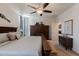 Bright main bedroom with a ceiling fan and natural light at 40707 W Pryor Ln, Maricopa, AZ 85138