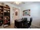Well-lit office space with a ceiling fan and a comfortable work desk at 40707 W Pryor Ln, Maricopa, AZ 85138