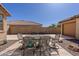 Outdoor patio area with table and chairs, ideal for dining and entertaining at 40707 W Pryor Ln, Maricopa, AZ 85138