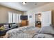 Bedroom featuring a sofa, window shutters and a television at 4539 W Beautiful Ln, Laveen, AZ 85339