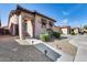 Charming single-story home featuring a stone-accented facade and well-manicured landscaping at 4539 W Beautiful Ln, Laveen, AZ 85339