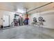 Spacious garage with shelving, bicycle rack and epoxy-coated floor at 4539 W Beautiful Ln, Laveen, AZ 85339