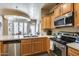 Bright kitchen with stainless steel appliances and an island at 4539 W Beautiful Ln, Laveen, AZ 85339