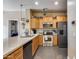 Modern kitchen with stainless steel appliances, granite countertops, and ample cabinetry at 4539 W Beautiful Ln, Laveen, AZ 85339