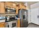 Well-equipped kitchen with stainless steel appliances and sleek cabinetry at 4539 W Beautiful Ln, Laveen, AZ 85339