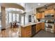 Bright kitchen with stainless steel appliances, an island, and breakfast nook at 4539 W Beautiful Ln, Laveen, AZ 85339