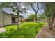 Spacious backyard featuring green lawn, privacy fence, mature trees, covered patio and hot tub at 4602 N 74Th Pl, Scottsdale, AZ 85251