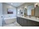 Stylish bathroom features a freestanding tub, double vanity, and modern fixtures for a spa-like experience at 4602 N 74Th Pl, Scottsdale, AZ 85251