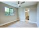 Light-filled bedroom with a bathroom, sleek flooring, and neutral walls, offering a comfortable atmosphere at 4602 N 74Th Pl, Scottsdale, AZ 85251