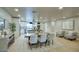 Bright dining area open to kitchen with modern table, chairs, and view of the kitchen island at 4602 N 74Th Pl, Scottsdale, AZ 85251