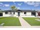 Charming single-story home featuring a well-manicured lawn and a welcoming walkway leading to the front door at 4602 N 74Th Pl, Scottsdale, AZ 85251