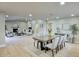 Open-concept living and dining area with wood floors, fireplace, and ample natural light at 4602 N 74Th Pl, Scottsdale, AZ 85251