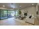 Bright living room with fireplace, comfortable seating, and large sliding doors to outdoor entertaining area at 4602 N 74Th Pl, Scottsdale, AZ 85251