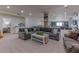 Spacious finished basement with comfortable seating, neutral carpet, and recreational areas at 4617 E Elmwood Cir, Mesa, AZ 85205