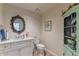 Bathroom featuring a vanity with granite countertop, a toilet, and decorative furniture at 4617 E Elmwood Cir, Mesa, AZ 85205