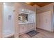 Bathroom with shower, white cabinets, and granite countertop at 4617 E Elmwood Cir, Mesa, AZ 85205