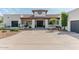 Charming single-story home with a welcoming entrance and well-manicured landscaping at 4617 E Elmwood Cir, Mesa, AZ 85205