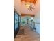 Well-lit entry foyer features tile flooring, chandelier, and high ceilings at 4617 E Elmwood Cir, Mesa, AZ 85205