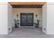 Covered entryway with double doors, sconces, and decorative wreaths offers curb appeal at 4617 E Elmwood Cir, Mesa, AZ 85205