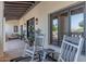 Rocking chairs and covered porch provide a comfortable outdoor living space at 4617 E Elmwood Cir, Mesa, AZ 85205