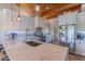 A modern kitchen features stainless steel appliances, a marble countertop, and open cabinets for storage at 4617 E Elmwood Cir, Mesa, AZ 85205