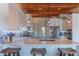 A modern kitchen has stainless steel appliances, marble countertops, and a large island at 4617 E Elmwood Cir, Mesa, AZ 85205