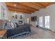 Spacious main bedroom featuring a fireplace, wood ceiling, and french doors at 4617 E Elmwood Cir, Mesa, AZ 85205