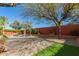 Relax in this backyard featuring lush green grass, mature trees and bushes, a swimming pool, and a putting green at 4901 S Vista Pl, Chandler, AZ 85248