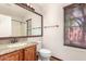This bathroom features granite countertops, a single sink, and wood blinds at 4901 S Vista Pl, Chandler, AZ 85248