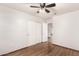 This bedroom features hardwood floors, a ceiling fan, and a closet at 4901 S Vista Pl, Chandler, AZ 85248