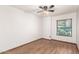 This bedroom is bright and airy with hardwood floors and a ceiling fan at 4901 S Vista Pl, Chandler, AZ 85248
