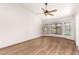 This primary bedroom offers bright, vaulted ceilings with a fan and many windows at 4901 S Vista Pl, Chandler, AZ 85248