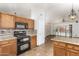 Bright eat-in kitchen boasts granite countertops, black appliances and tile flooring at 4901 S Vista Pl, Chandler, AZ 85248