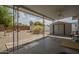 Covered patio shows backyard with gravel and storage shed at 5317 E Baltimore St, Mesa, AZ 85205