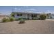 Inviting single-story home with gravel landscaping, desert plants, and an attached garage at 5317 E Baltimore St, Mesa, AZ 85205