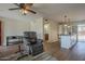 Spacious living area featuring wood flooring, comfortable seating, and an open layout at 5317 E Baltimore St, Mesa, AZ 85205